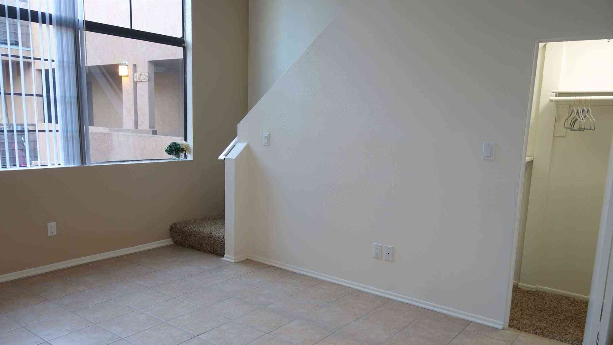 spacious living room with closet storage