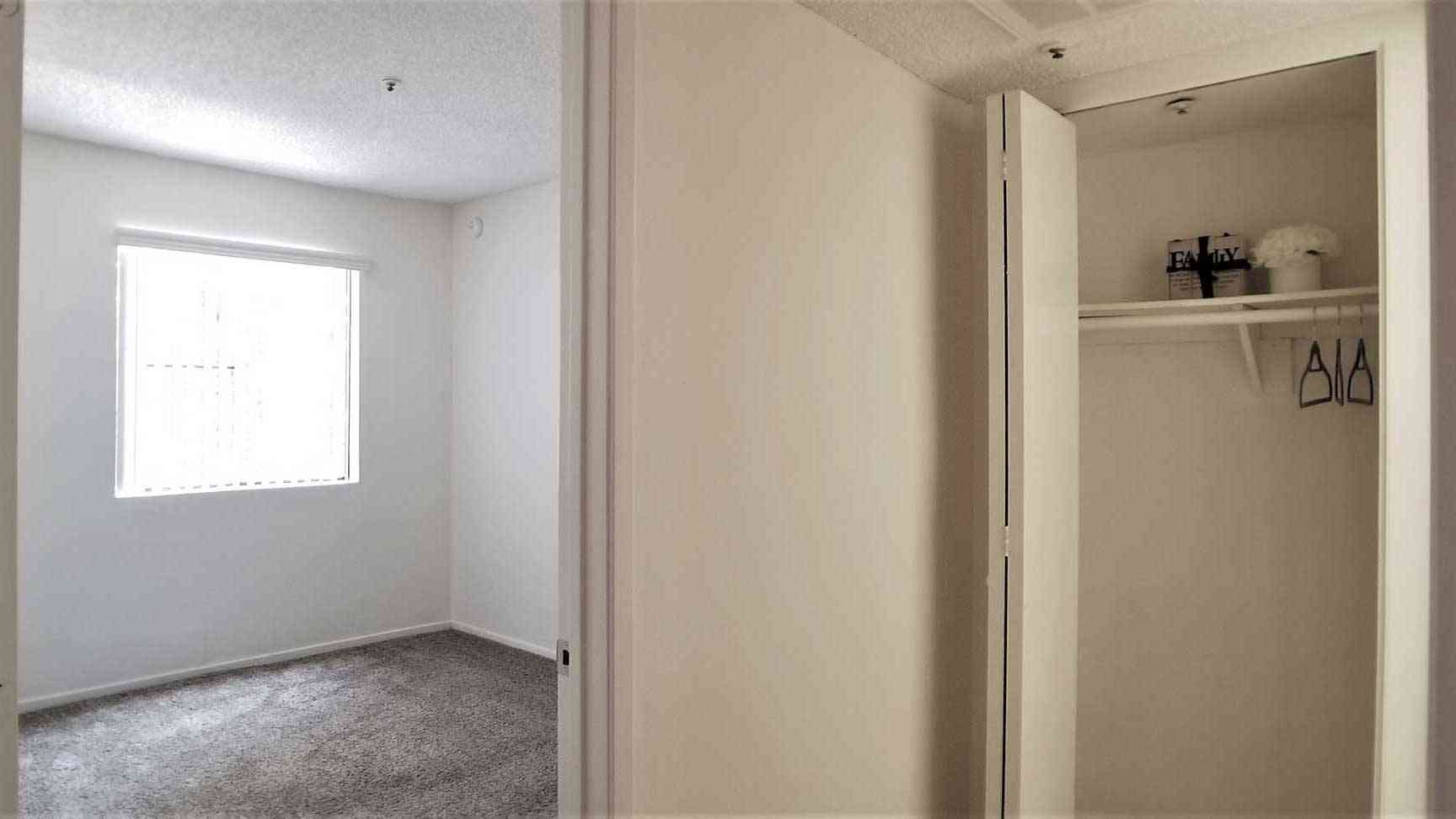 bedroom entrance revealing built in closet storage