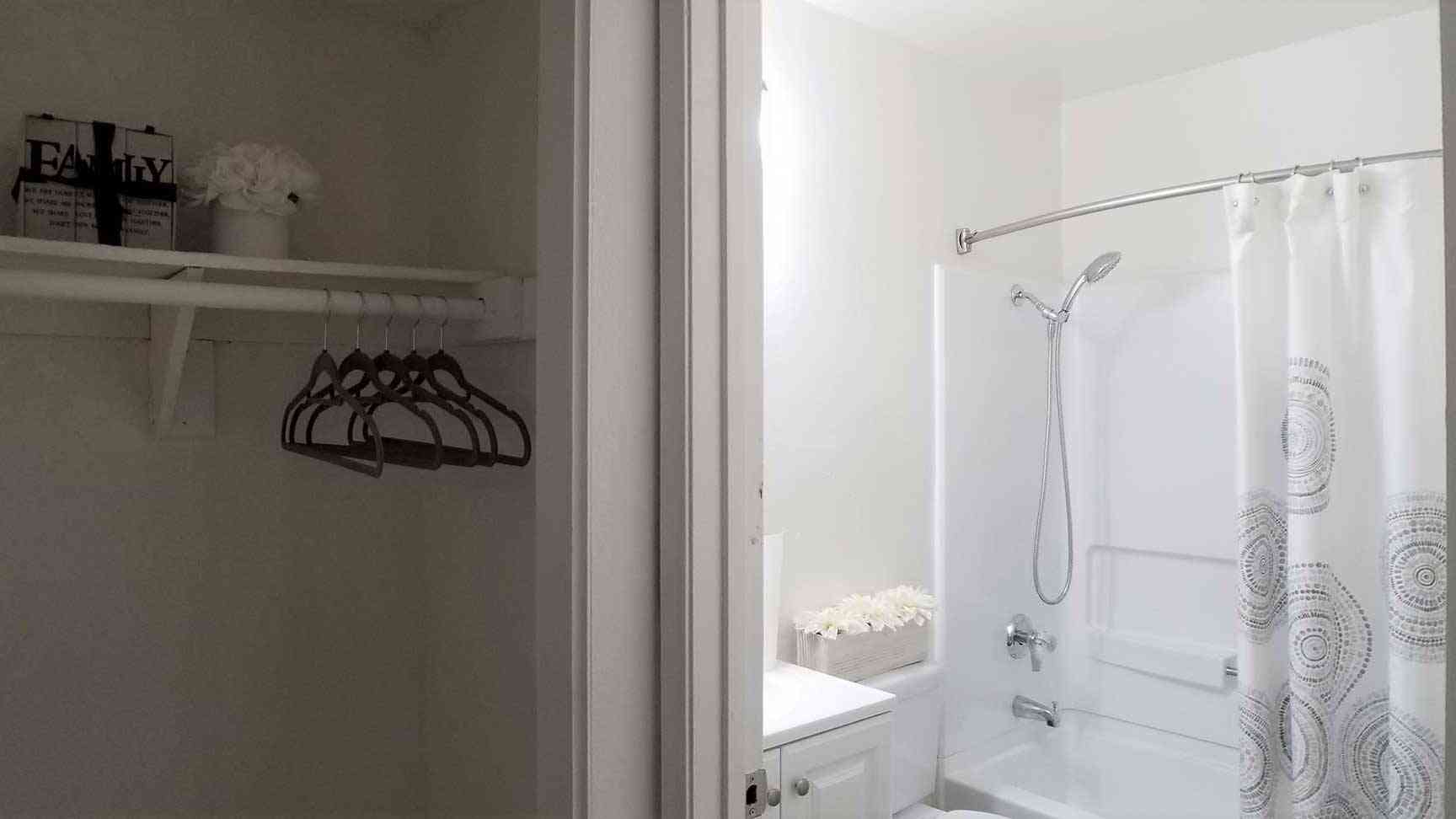 view from closet into updated bathroom