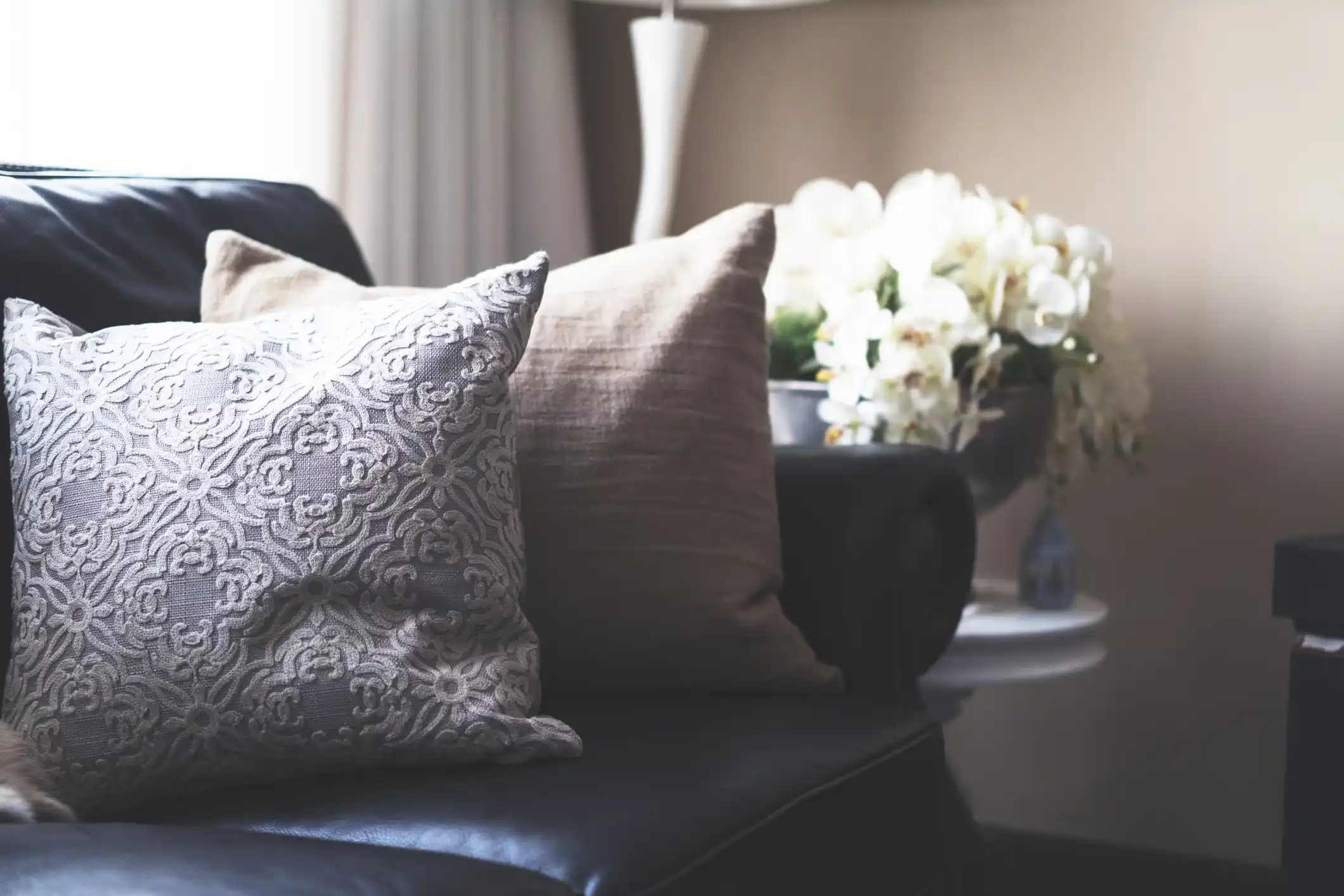 Broadway Apartments apartment styling with decorative pillows on couch